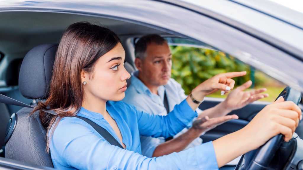 A learner and driving instructor inside a car